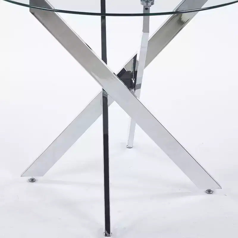 Elegante tavolo da pranzo dorato con ripiano in vetro e gambe incrociate