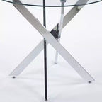Elegante tavolo da pranzo dorato con ripiano in vetro e gambe incrociate