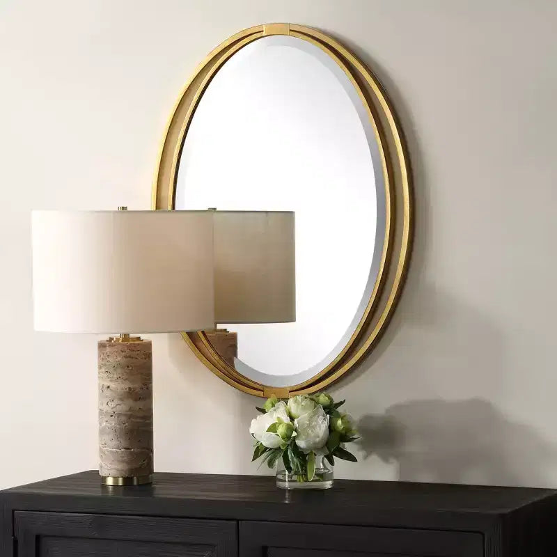 Specchio da parete ovale Uttermost Rhodes con foglia d'oro metallizzato 24 1/4 x 32