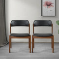 Sedie da pranzo in pelle vegana Mid-Century Modern con base in noce – Nero / Marrone medio